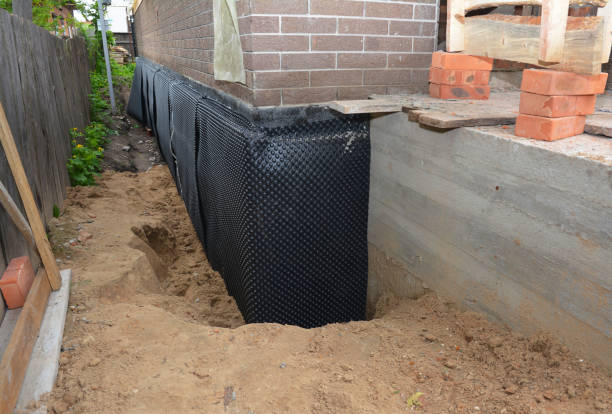 Happy homeowners after waterproofing job in Byron